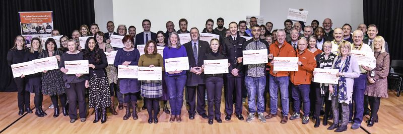 Image from the Safer Communities Fund Awards showing all the projects with their cheques